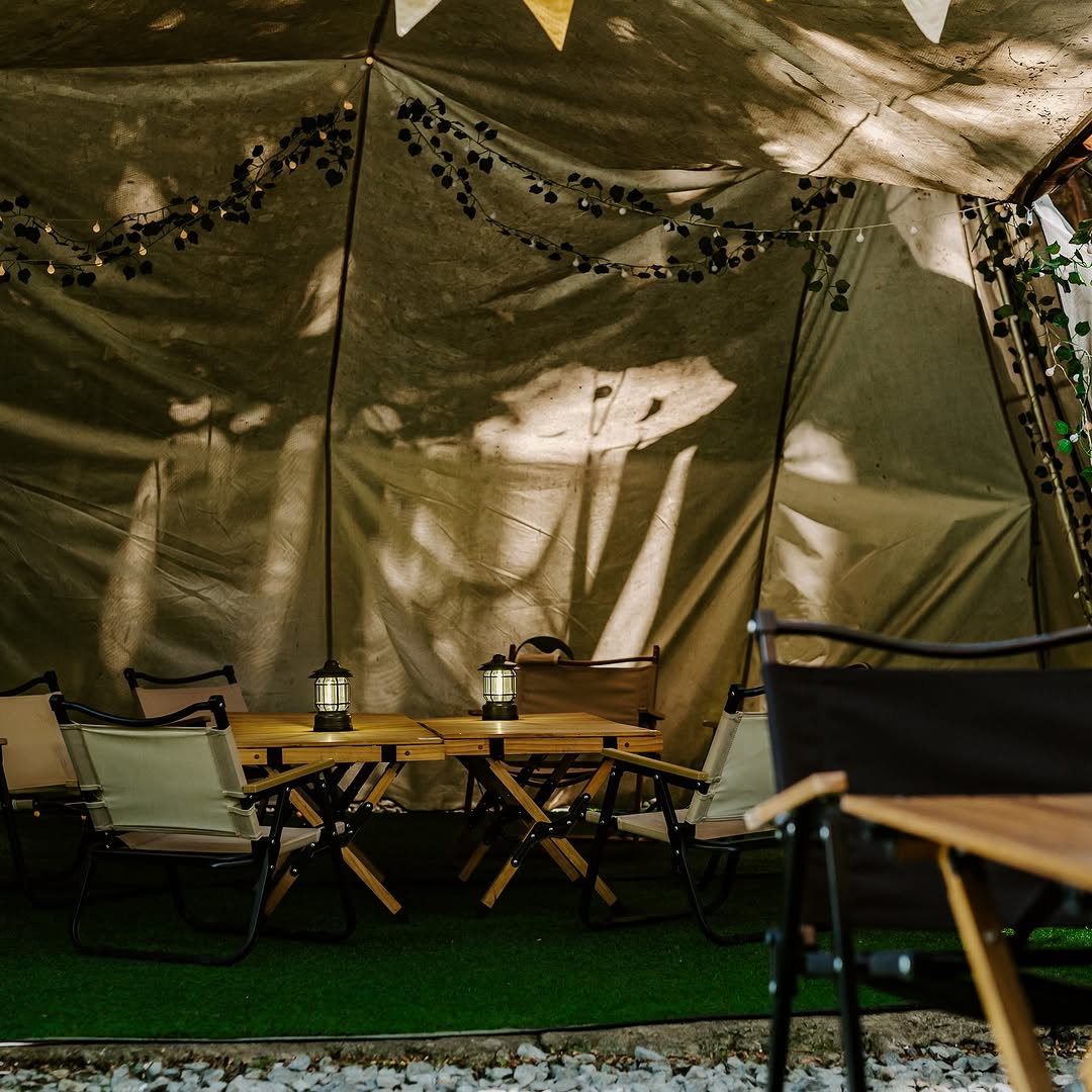 Inside the camping tent seating at Kamp Lilim — night ambiance